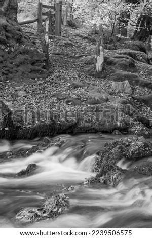 Long exposure of the Weir Water river flowing downstream of Robbers Bridge in Exmoor National Park