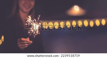 girl enjoying fireworks at festival,This image contains copy space.