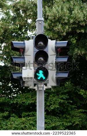 there is a green male on the traffic light