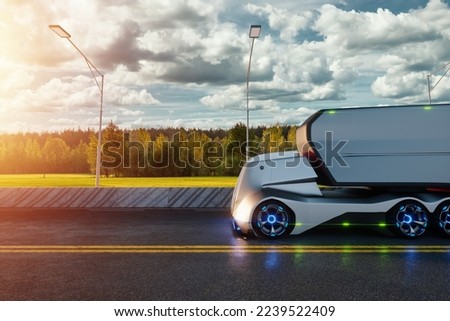 Unmanned autonomous cargo transportation. An autonomous, electric, self-driving truck with a trailer moves along the road. Fast cargo delivery, transportation without drivers Royalty-Free Stock Photo #2239522409