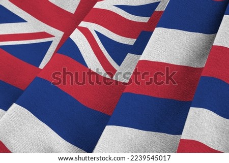 Hawaii US state flag with big folds waving close up under the studio light indoors. The official symbols and colors in fabric banner
