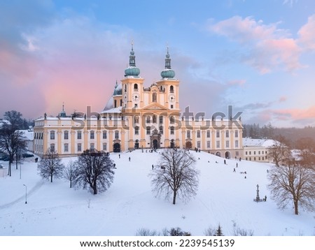 Winter mood: Aerial view of the Pilgrimage church of Minor Basilica of the Visitation of the  Virgin Mary covered with snow. A pilgrimage site. Winter view, pastel colors. Christmas Time. Czechia.