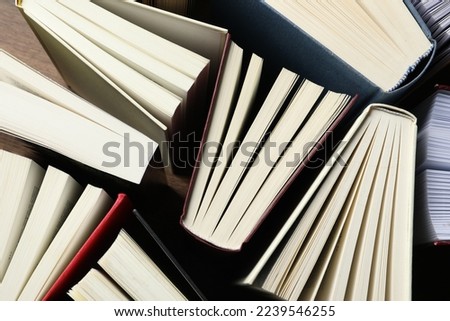 Many hardcover books as background, top view