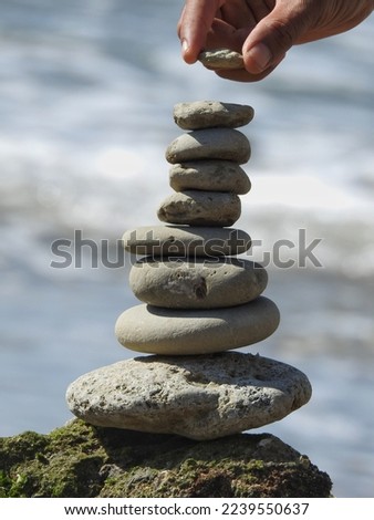 Rock balancing or stacks of stone inside beach.