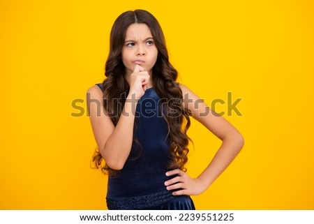 Thinking face, thoughtful emotions of teenager girl. Little kid girl 12,13, 14 years old on isolated background. Children studio portrait. Emotional kids face. Royalty-Free Stock Photo #2239551225