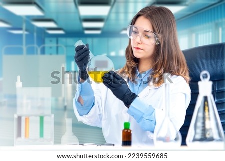Medical woman. Nurse holds test tube with pharmacology reagent. Girl student studying pharmacology. Woman student of medical university. Research in field of pharmacology. Woman working in clinic Royalty-Free Stock Photo #2239559685