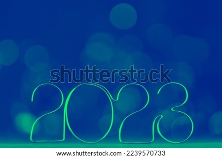 Happy New Year 2023. Beautiful web banner or billboard template with ecological green new year number 2023 on blue background with copy space for text High quality photo