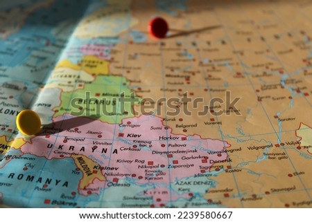 russia and ukrain location on map with red thumbtack, travel idea, moscow and kiev on map with a red fastener, vacation and road trip concept, pinned destination, top view