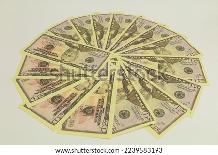 The bills of money lie on a white background