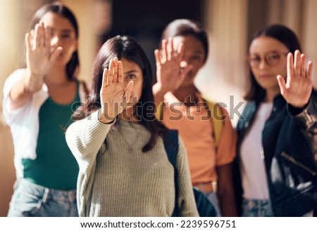 Woman, student and hands in stop for protest, enough or team standing for human rights or women empowerment. Group of female students with raised hand in halt, unity or strike for safe education Royalty-Free Stock Photo #2239596751