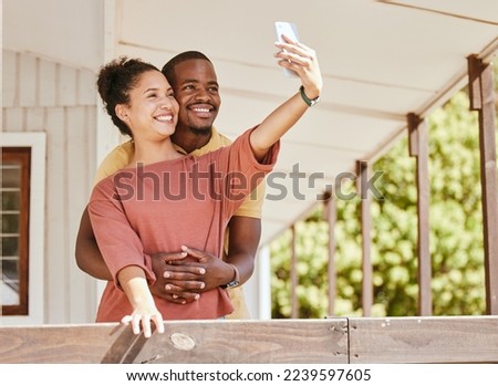 Love, phone selfie and black couple in home by balcony, bonding and having fun. Romance, hug and man and woman taking pictures on mobile smartphone for happy memory, social media or profile picture.