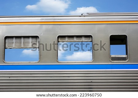 Window of train with blue sky as background