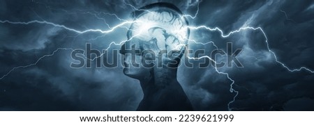 Silhouette of a man's head with x-rayed head and lightning coming out of the brain. Conceptual idea and symbol of the work of the brain, thinking, psychology, psychiatry, religion, science, education.