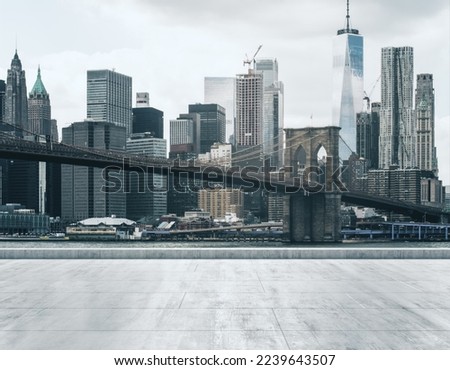 Empty concrete dirty embankment on the background of a beautiful NY city skyline and Brooklyn bridge at morning, mock up