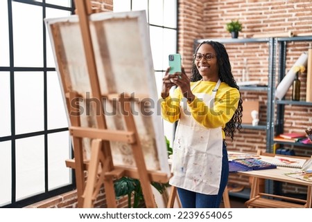 African american woman artist make picture by the smartphone to draw at art studio