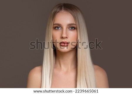 portrait of a beautiful woman with straight hair and makeup. copyspace Royalty-Free Stock Photo #2239665061