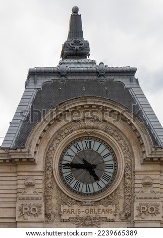 Paris, France; 25 July, 2022: Musée d'Orsay building and clock, view from the Seine river. Royalty-Free Stock Photo #2239665389