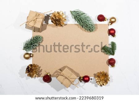 Mockup for a letter or a Christmas invitation with gold fir cone