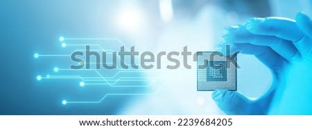 Close-up of Professional Scientist Holding a Modern Microprocessor Chip in Hand. Scientific Laboratory, Research and Development of Microelectronics and Processors. Computer Technology and Equipment. Royalty-Free Stock Photo #2239684205
