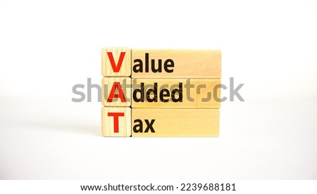 VAT, value added tax symbol. Wooden blocks with concept words 'VAT, value added tax'. Beautiful white background, copy space. Business and VAT, value added tax concept.