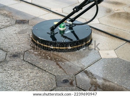 Close up Pressure Washing Driveway Surface Cleaning Royalty-Free Stock Photo #2239690947