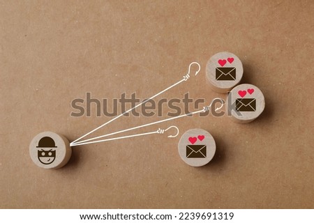 Wooden cube blocks with scammer and envelope symbols. Love scam and trap concept. Royalty-Free Stock Photo #2239691319
