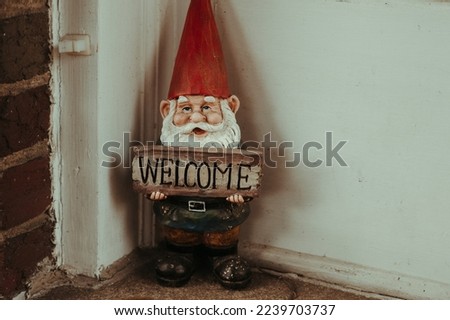Welcome Sign Gnome. Gnome with red hat. Garden Gnome