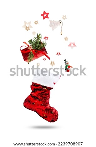 Santa's red stocking. Gifts flying. Concept of christmas or holiday. isolated on a white background. vertical frame