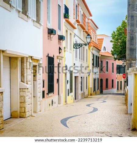 Pedestian cobblestone street in Cascais, Portugal Royalty-Free Stock Photo #2239713219