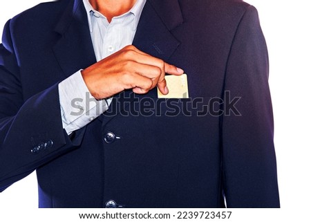 Part of body of business man who takes out business card from the pocket of business sui