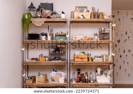 Tool cabinet of an arts and crafts workshop. Royalty-Free Stock Photo #2239724371