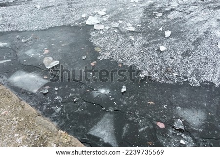 Frosted pond next to Brasserie Mariadal building in Zaventem, Belgium Royalty-Free Stock Photo #2239735569