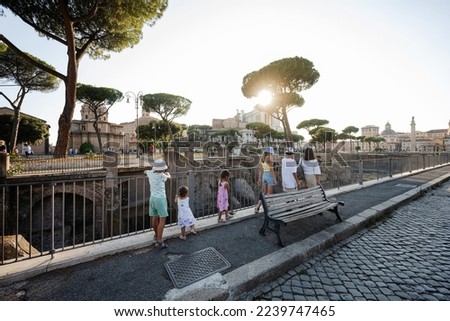 Family tourists near Forum of Augustus in Rome, Italy.