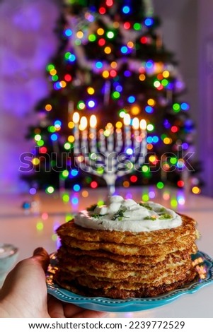 For Hanukkah, crispy potato latkes are a traditional Jewish food dish.