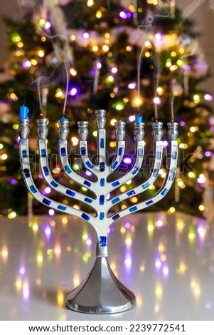 As part of Hanukkah traditions, a menorah is lit with nine candles.