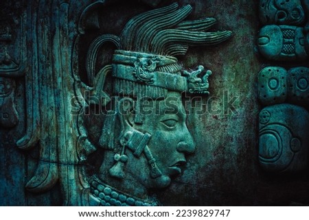 Mayan stela, stone relief of the Mayan culture, glyphs and pre-Hispanic forms. Stone textured background. Royalty-Free Stock Photo #2239829747