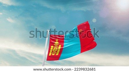 Mongolia Flag on pole for Independence day. The symbol of the state on wavy cotton fabric.