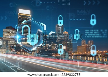 City view panorama of Boston Harbor and Seaport Blvd at night time, Massachusetts. Building exteriors of financial downtown. Glowing Padlock hologram. Concept of cyber security to protect information