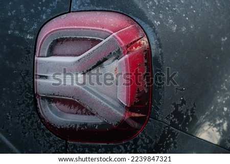 Freezing winter morning. Close up detail view of a frozen car because of the very low temperatures.