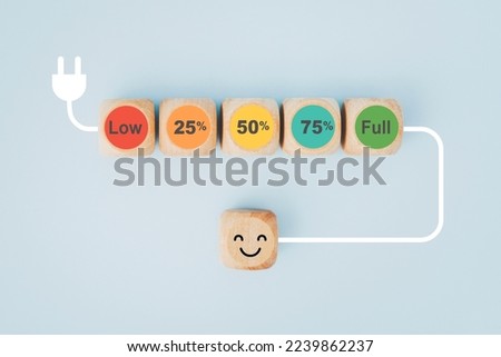 percentage on loading bar wooden cube block with plug for mental health assessment, child wellness ,world mental health day, think positive, boost energy level concept Royalty-Free Stock Photo #2239862237