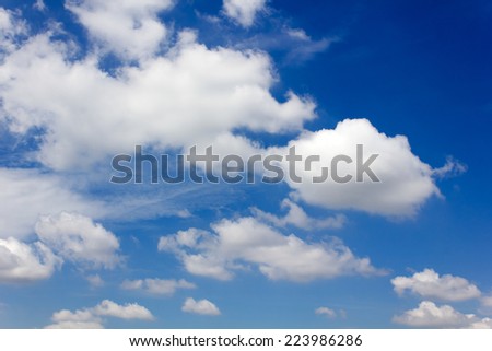white clouds in the blue sky.