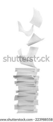 Sheets of paper falling onto stacked ones on white background