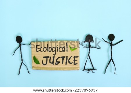 Ecological justice concept. People stick figures protesting while holding a carton placard.