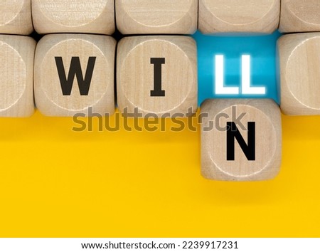 We will win symbol. Businessman turns cubes and changes the word will to win. Beautiful white background, copy space. Business, motivational and we will win concept. Royalty-Free Stock Photo #2239917231