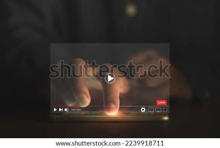 Man touching smartphone to watching and live streaming window for Video streaming on internet and multimedia technology concept. Royalty-Free Stock Photo #2239918711