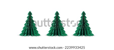 A row of paper Christmas trees isolated on white background.	