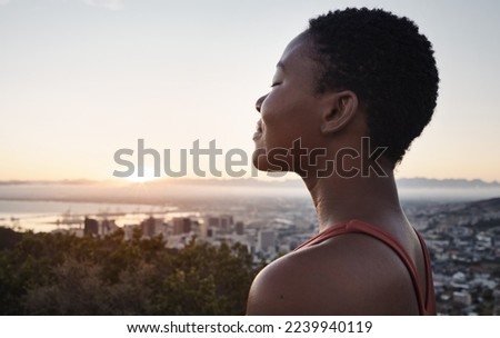 Fitness, breathing or zen black woman in meditation in nature thinking of wellness goals, vision or target. Healthy, spiritual or peaceful happy African girl smiles or relaxing to meditate at sunset