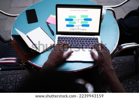 Cropped image of skilled software developer working with web data diagrams connecting to 4g wireless internet during distance job, male student e learning education infographics using laptop