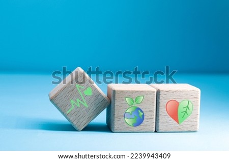 plant health concept represented in icons on wooden block cubes