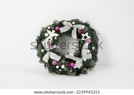 
From Christmas decorations.Christmas holiday composition. Xmas wreath with decorations on white background. Christmas, New Year, winter concept. Flat lay, top view, copy space